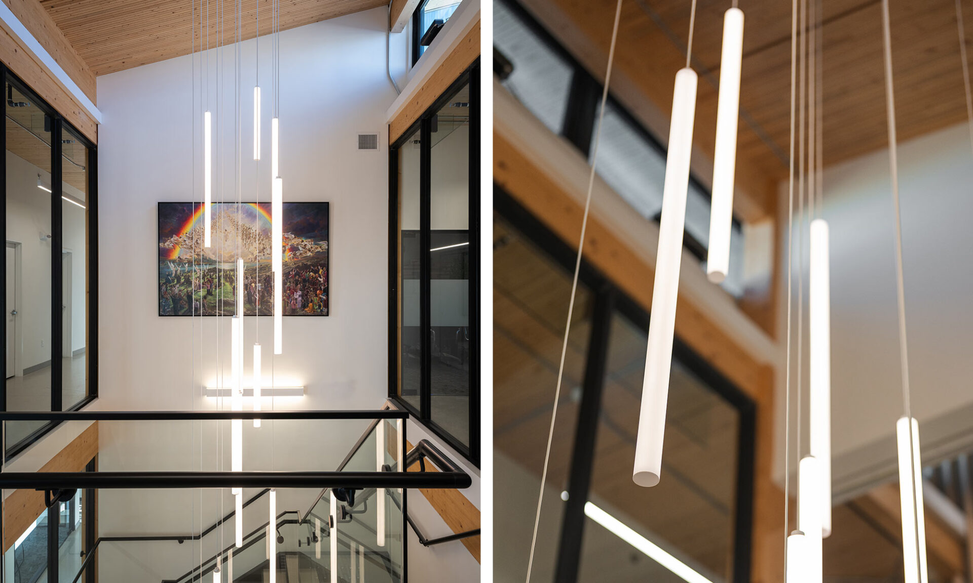 Four-storey stairwell with 13 cascading SPI Lighting Pavo cylinder pendants suspended at varied heights.