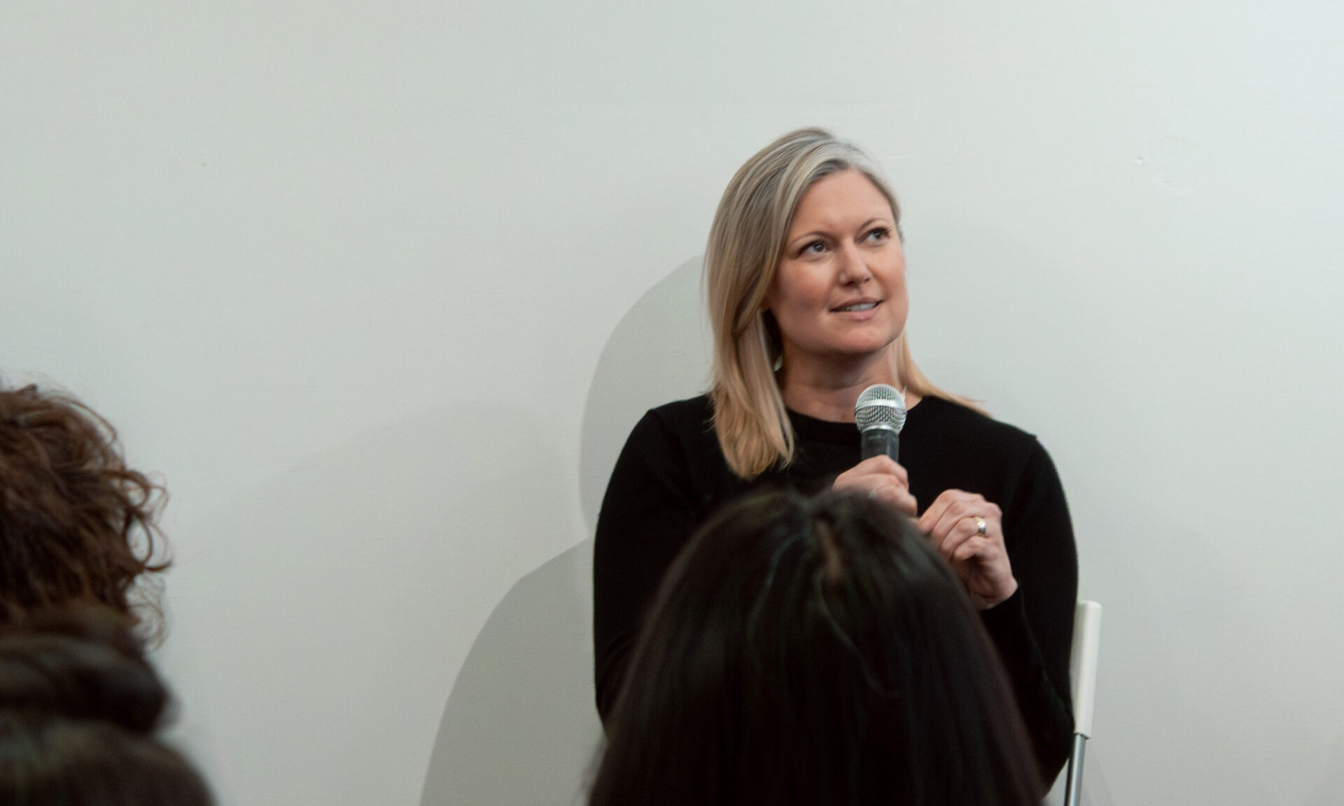 Andrea Greenway of Ste Marie Studio speaking at a panel about lighting coordination and protecting design intent.