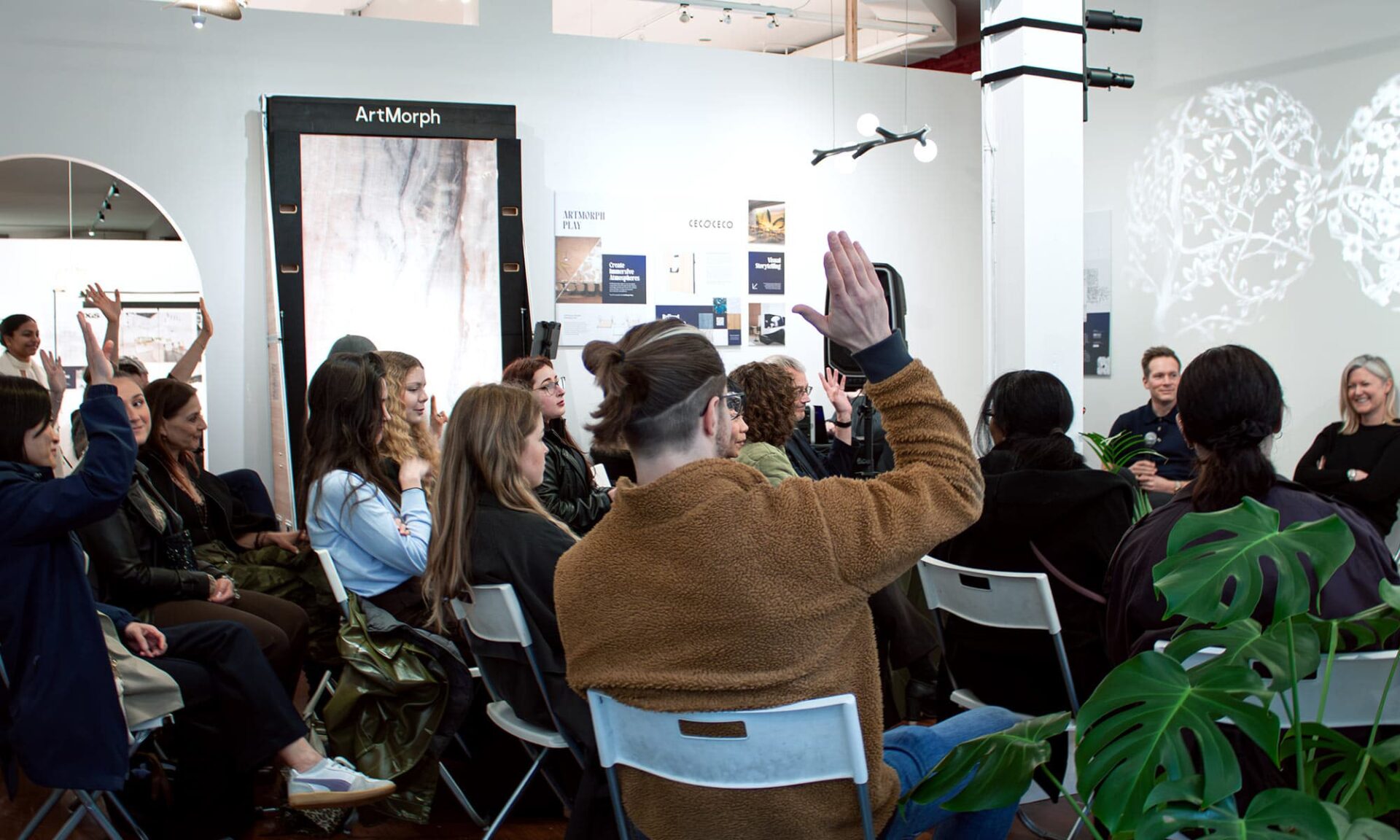 Audience listening to a panel discussion about lighting coordination, value engineering, and protecting design intent.